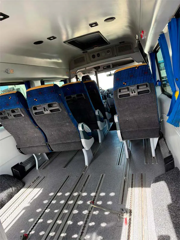 Accessible interior with wheelchair anchoring rails